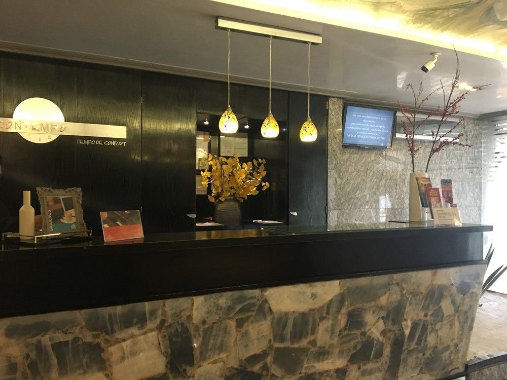 Suites Contempo Мехико Экстерьер фото Reception desk at the hotel